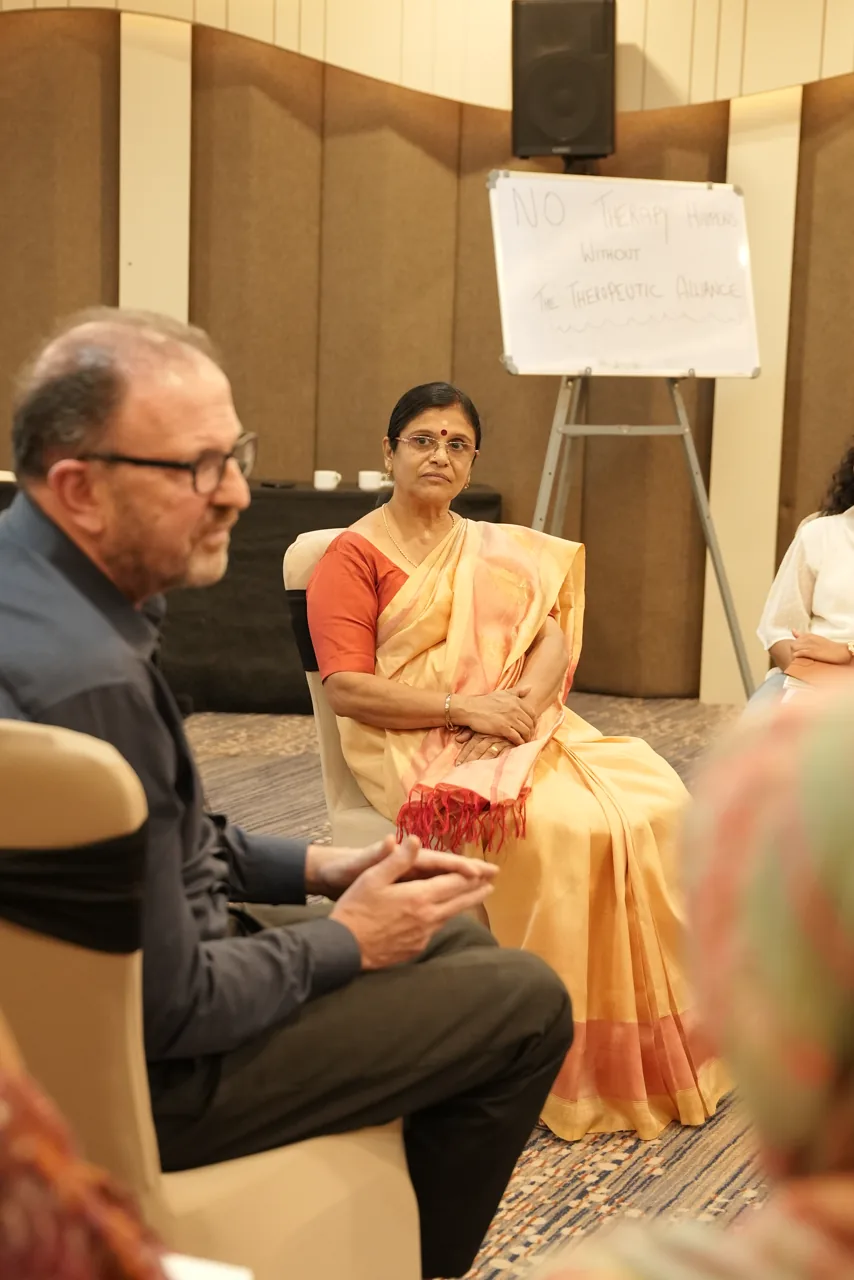 Dr John working with a participant on therapeutic alliance