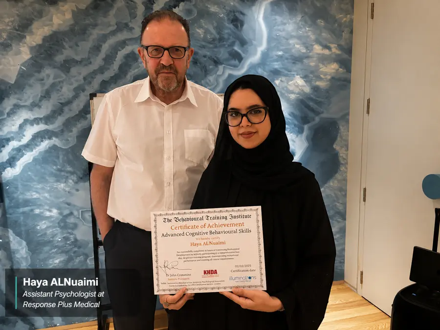 Haya ALNuaimi, Assistant Psychologist (Response Plus Medical, Dubai), receiving her Advanced CBT certificate from Dr John Crimmins