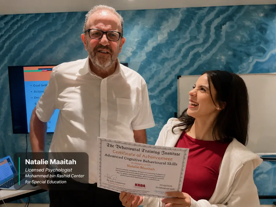 Natalie Maaitah, Licensed Psychologist (Mohammed bin Rashid Center, Dubai), receiving her Advanced CBT certificate from Dr John Crimmins