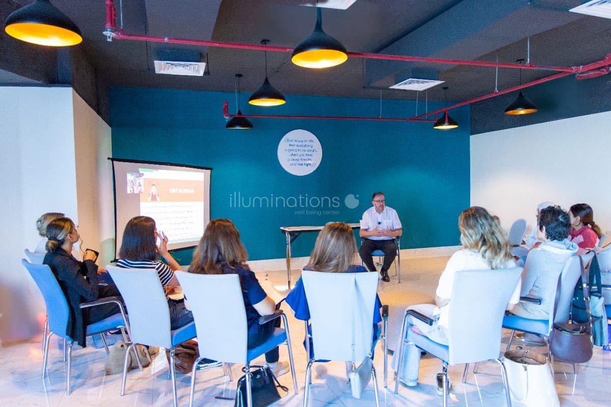 Dr. John Crimmins teaching CBT Schema to a full audience at Illuminations Well Being Center, Dubai